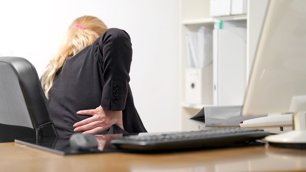 A woman is worried about pain in the lumbar region